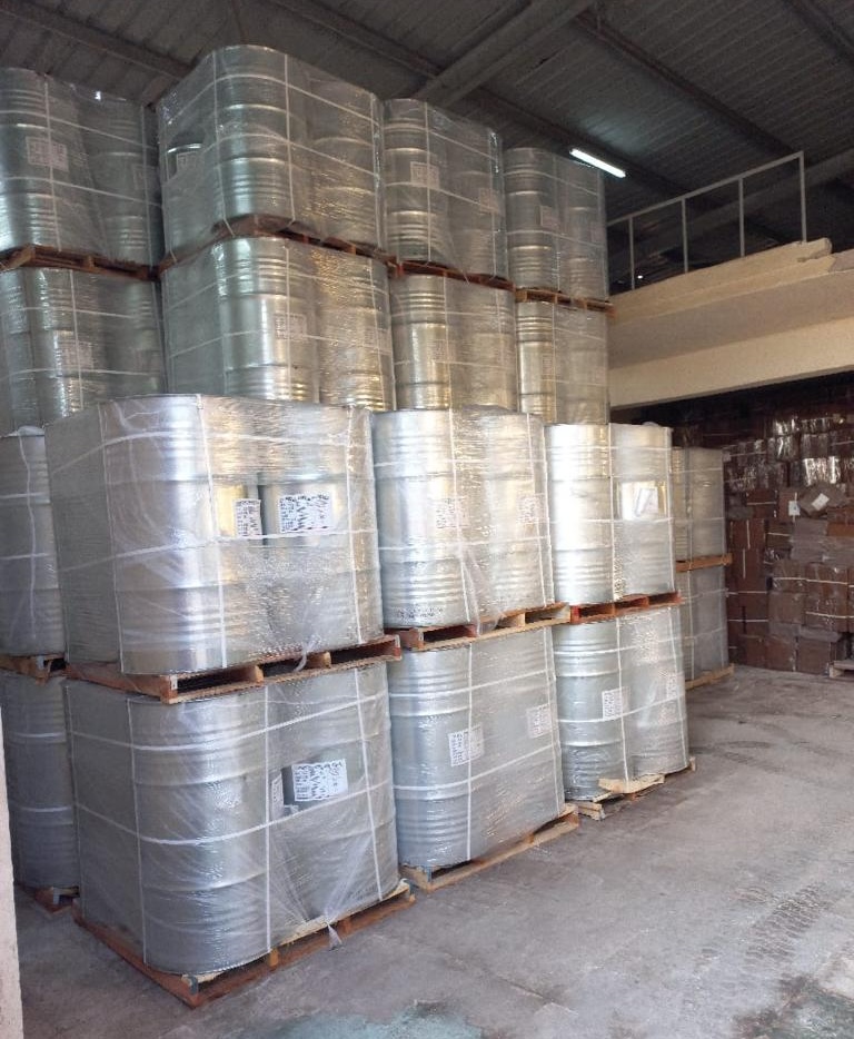Silver drums and barrels stacked in Magico Freezone warehouse